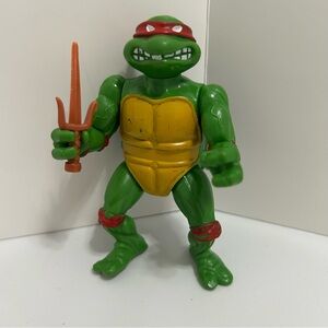 Green Ninja Turtle Action Figure with Orange Weapon